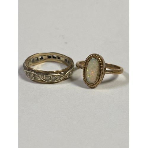 132 - A 9ct gold opal set ring, together with an eternity band (a/f) -