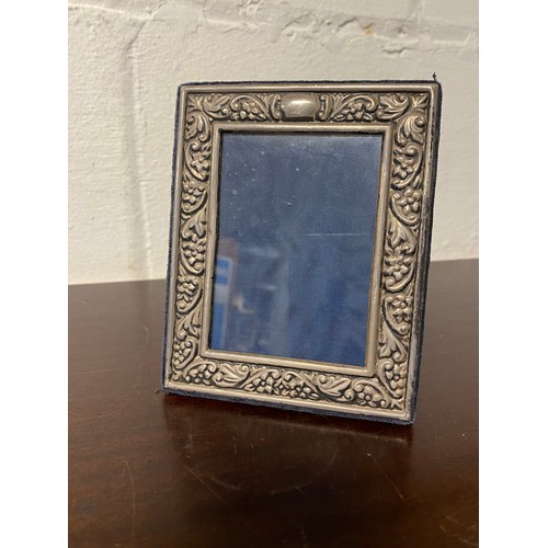 22A - A silver faced photograph frame, with easel back -