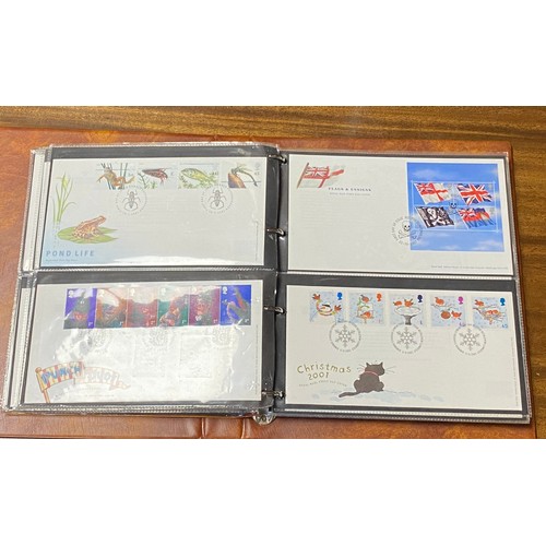 206 - Stamps: a Post Office album containing 60 R M covers, Oct 2000-2005, together with two BFDC cover al... 