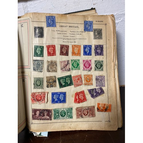 212 - Stamps: a GB and World album, together with a mixed lot of postcards, coins and cigarette cards -