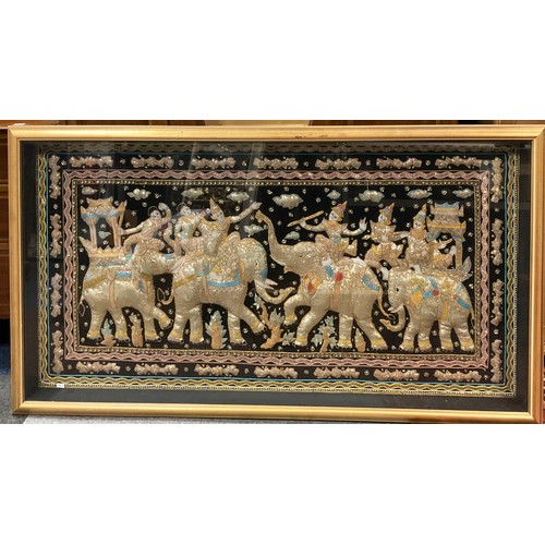 213 - An impressive Burmese 'Kalaga' panel, worked with metallic threads and sequins, with four elephants ... 