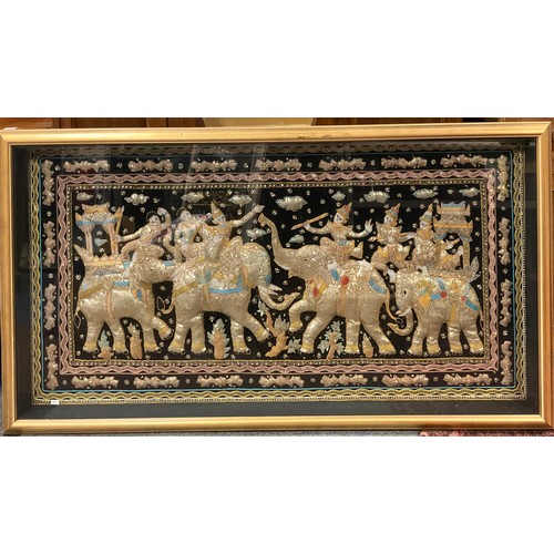 213 - An impressive Burmese 'Kalaga' panel, worked with metallic threads and sequins, with four elephants ... 