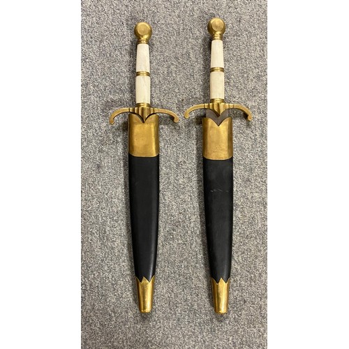 438 - A pair of replica short swords -