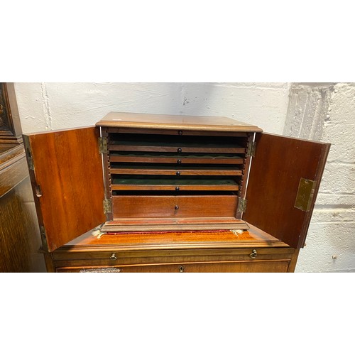 94 - A 19th century coin/collectors cabinet, with two panelled doors enclosing five drawers -