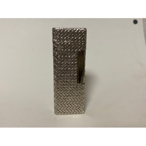 47 - Dunhill: a 'Rollagas' cigarette lighter, in woven textured white metal case, stamped 750 to base and... 