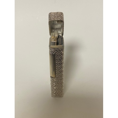 47 - Dunhill: a 'Rollagas' cigarette lighter, in woven textured white metal case, stamped 750 to base and... 