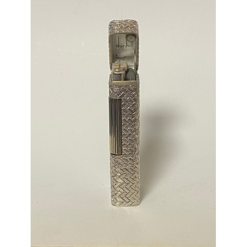 47 - Dunhill: a 'Rollagas' cigarette lighter, in woven textured white metal case, stamped 750 to base and... 