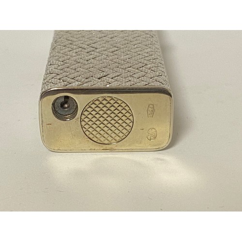 47 - Dunhill: a 'Rollagas' cigarette lighter, in woven textured white metal case, stamped 750 to base and... 