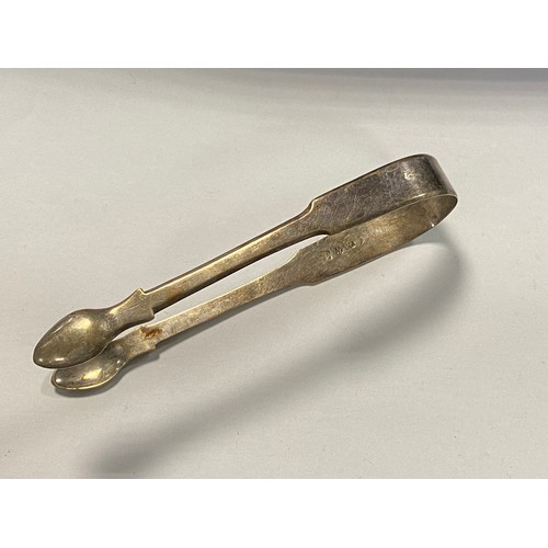 56 - A pair of Georgian silver tongs, Newcastle, date rubbed, together with a quantity of silver plated f... 