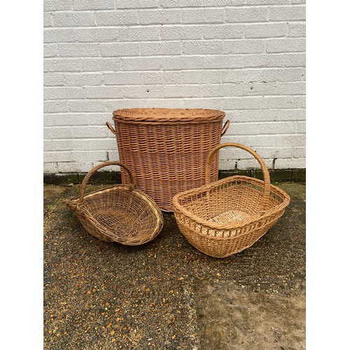 409 - A wicker linen basket and two baskets -