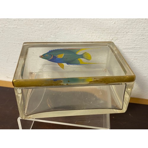 125 - A glass box, rectangular and painted with tropical fish, together with ten matching dishes -