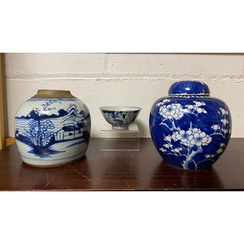 130 - A provincial Chinese blue and white ginger jar, together with a prunus decorated jar and cover and a... 