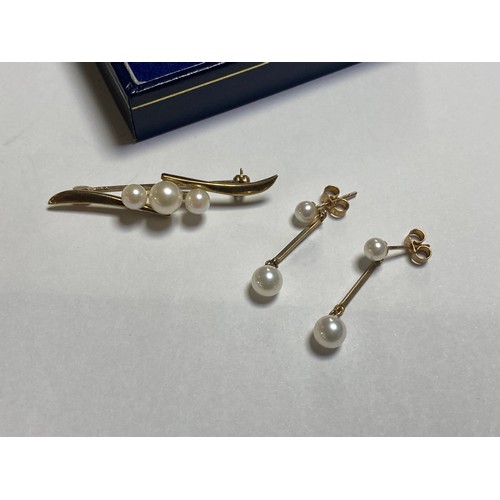 85 - A 9ct gold and cultured pearl brooch, together with a pair of gold and pearl earrings, both in Mikim... 