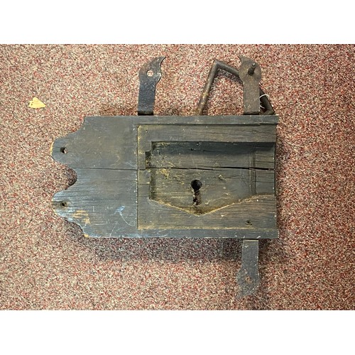 105 - An antique oak lock plate, (lacking mechanism) -