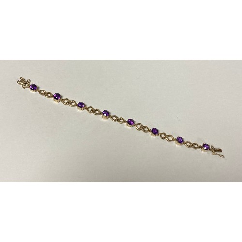 12 - A 9ct gold bracelet, set with circular amethysts and shaped links -