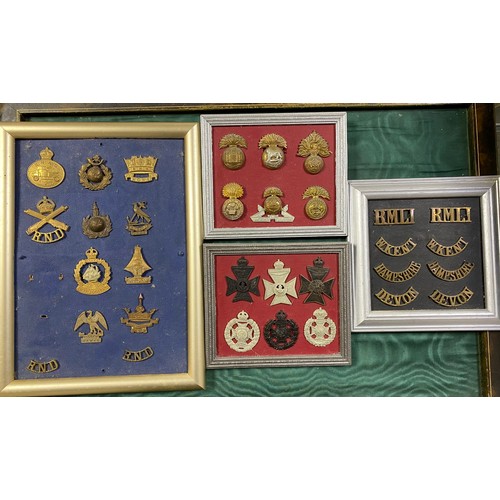 289 - Militaria: a quantity of cap badges, some mounted -