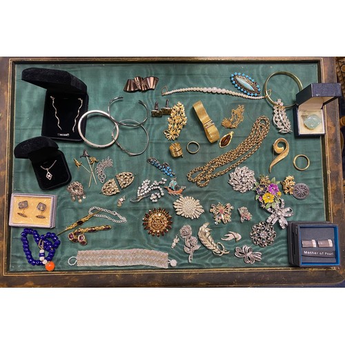 40 - A group of silver and costume jewellery, including silver bangles, paste brooches etc -