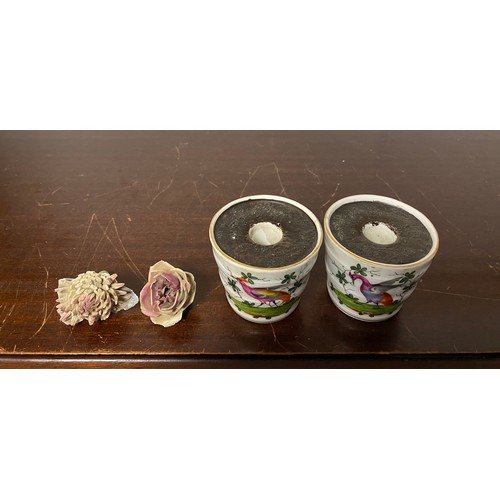 148 - A pair of Meissen style flower pots, of small size, each painted with birds and insects -