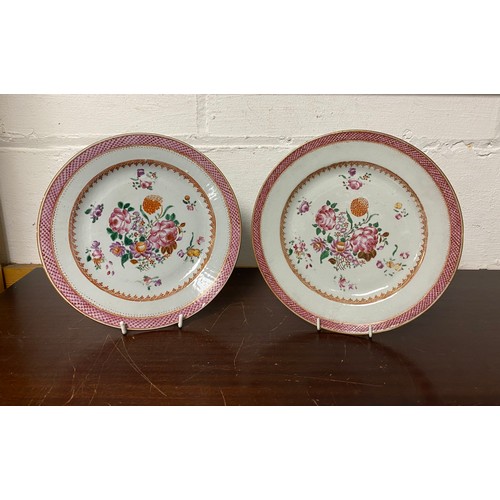 159 - A pair of Chinese famille rose plates, each enamelled with flowers -