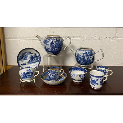 161 - A blue and white teacup and saucer, together with two teapots (lacking covers) and other teawares -