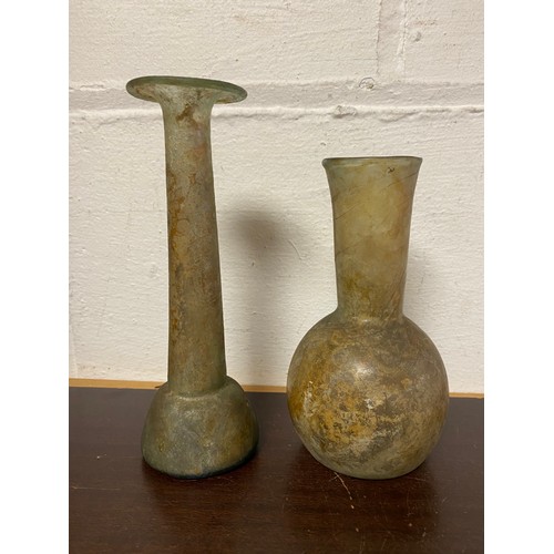 163 - A Roman glass candlestick vase/unguentarium, and another glass vase, both with iridescence -