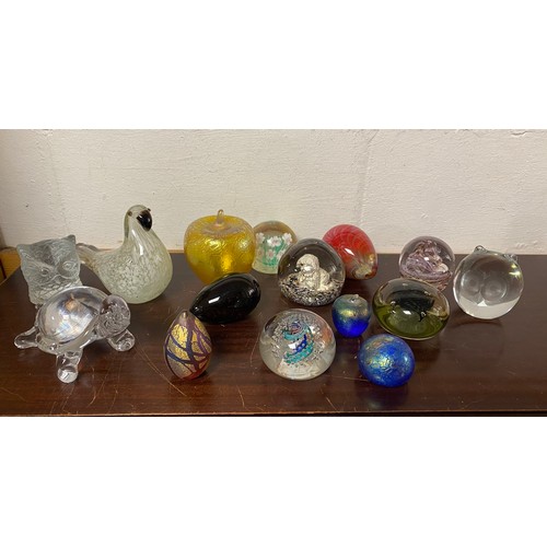 166 - A quantity of glass paperweights -