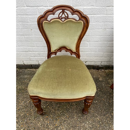 432 - A Victorian walnut framed chair, with moulded framed, upholstered back and seat and lobed legs -