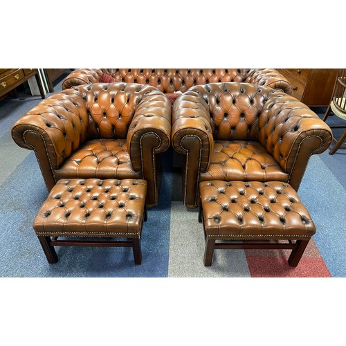 435 - A pair of brown upholstered Chesterfield style armchairs, together with a pair of matching stools (4... 