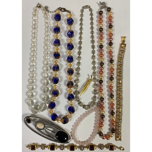 71 - A quantity of costume jewellery, including paste necklace -