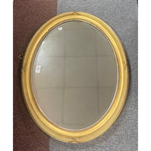 430 - A gilt framed oval wall mirror -