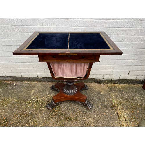 278 - A 19th century rosewood work table, with swivel foldover top, over drawer and slide bag, on quatrefo... 