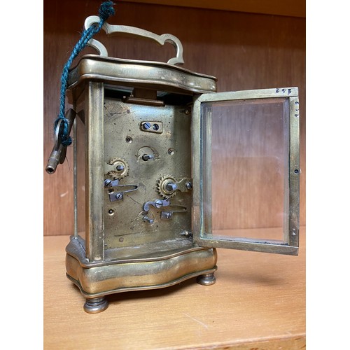 293 - A French brass cased carriage clock and key -