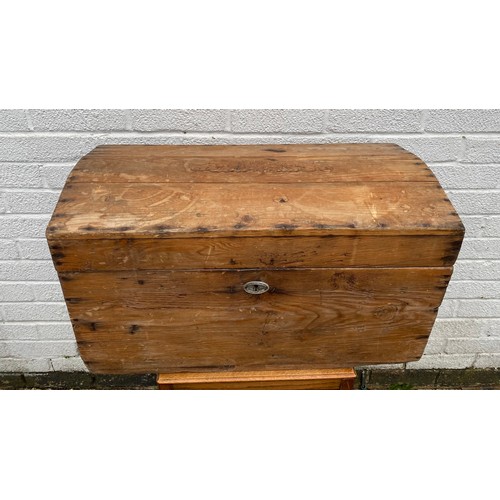 294 - A pine dome topped trunk, with shell carry handles -