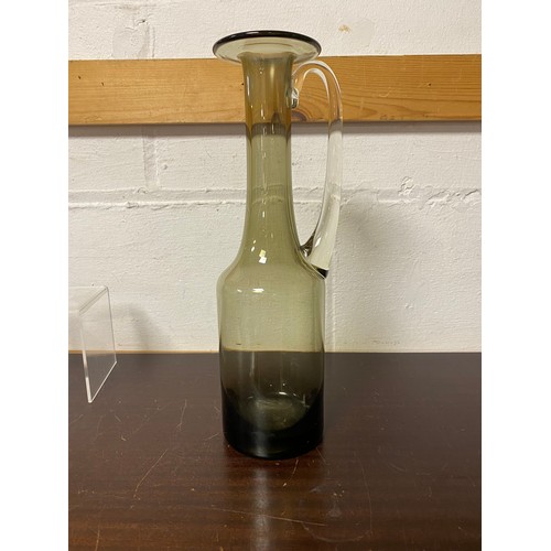 92 - A mid-century Holmgaard jug, together with another similar stopper and other glasses -