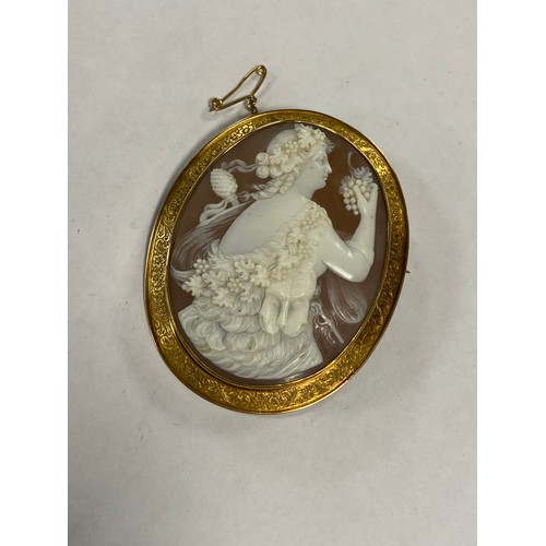 41 - A  large Victorian cameo brooch, the shell cameo carved with Cybele with lion, grapes and garland, t... 