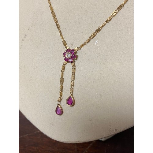 43 - A 9ct gold gem set pendant necklace, set with a diamond and pink stone cluster, suspending two pear ... 