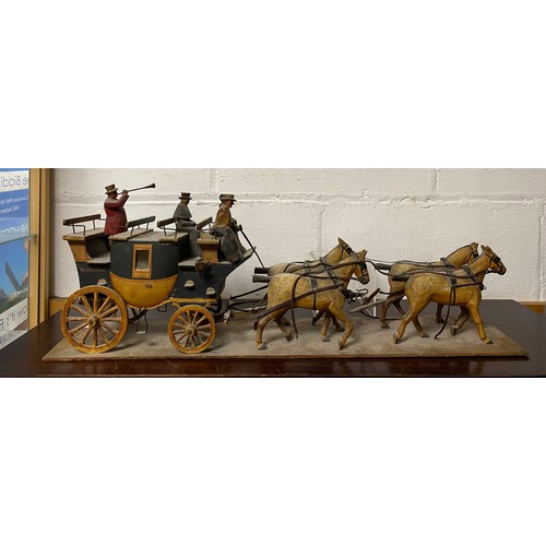 232 - A vintage model coach and horses -