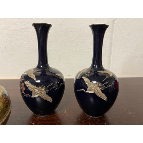 79 - A pair of Japanese cloisonne vases, each decorated with cranes on a blue ground (a/f) and a Satsuma ... 