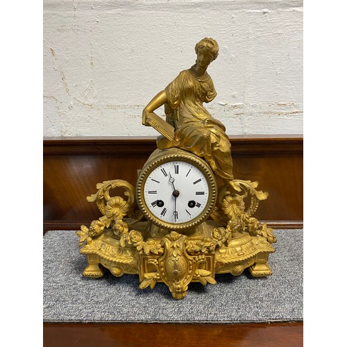 326 - A gilt metal figural mantel clock, surmounted by a lady reading (a/f) -