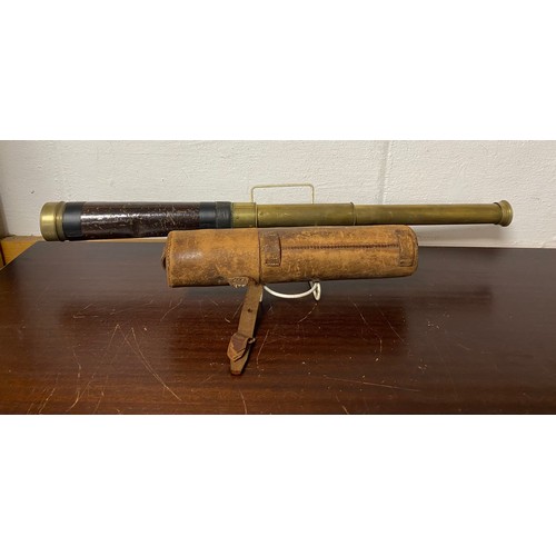 255 - A two draw brass telescope, signed for Simon & Beck, 6 Coleman Street, London in leather case -