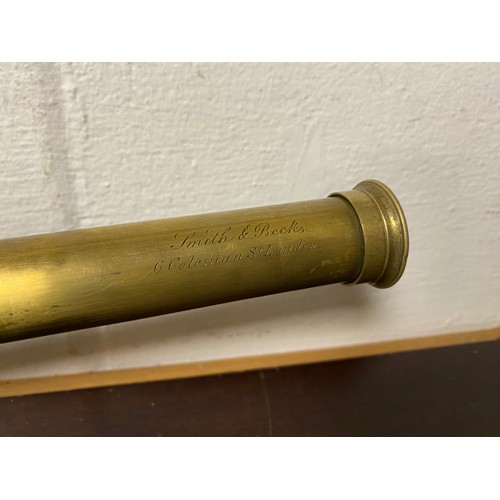 255 - A two draw brass telescope, signed for Simon & Beck, 6 Coleman Street, London in leather case -