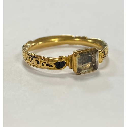 52 - An 18th century enamel and gold mourning ring, dated 1746, with rock crystal panel to front -