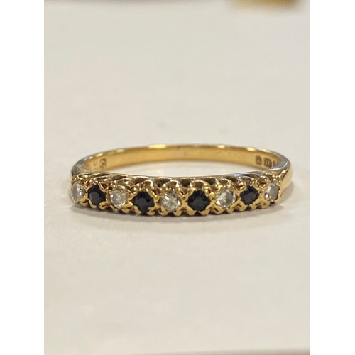 54 - A 9ct gold half eternity band, set with alternate sapphires and diamond points -