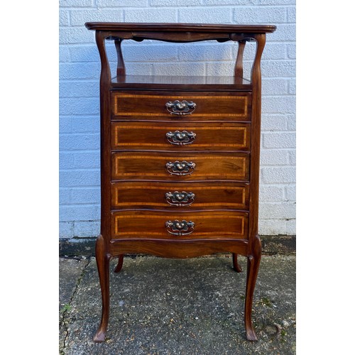 334 - A mahogany and inlaid music cabinet, with shaped top over open shelf and five graduated fall front d... 