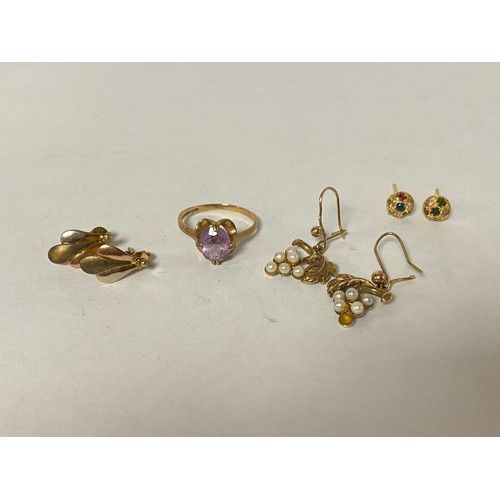 10 - A 9ct gold ring set with an amethyst, together with two pairs of 9ct gold earrings -