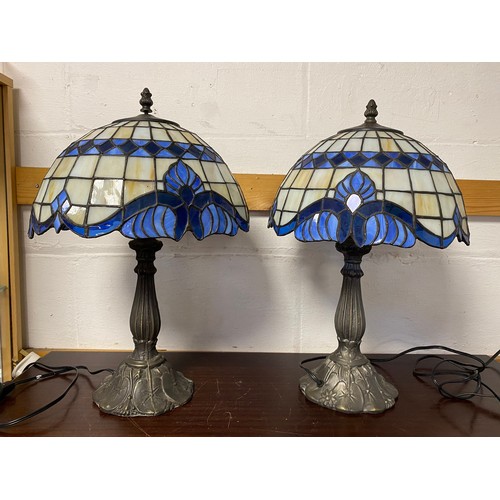 346 - A pair of Tiffany style table lamps, each with blue and cream coloured shades -