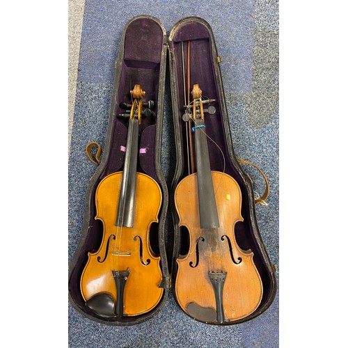 243 - A cased violin together with another violin -