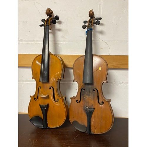 243 - A cased violin together with another violin -