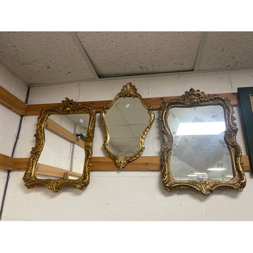 311 - A pair of gilt framed wall mirrors and another smaller (3) -