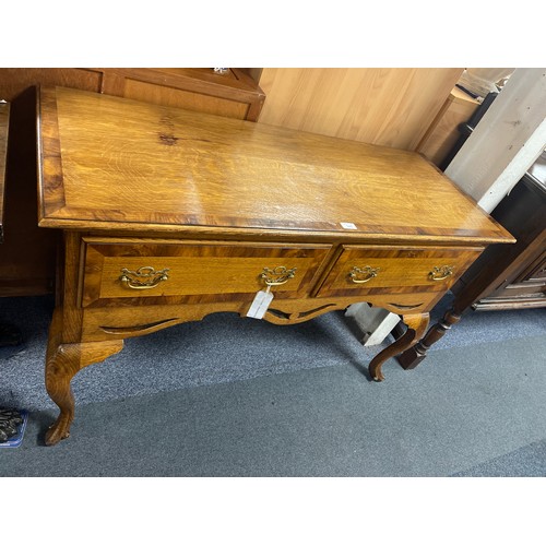 349 - A Georgian style oak side table, with crossbanded top over two drawers and cabriole legs -